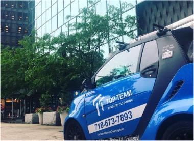 Top Team window cleaning car parked in New York City